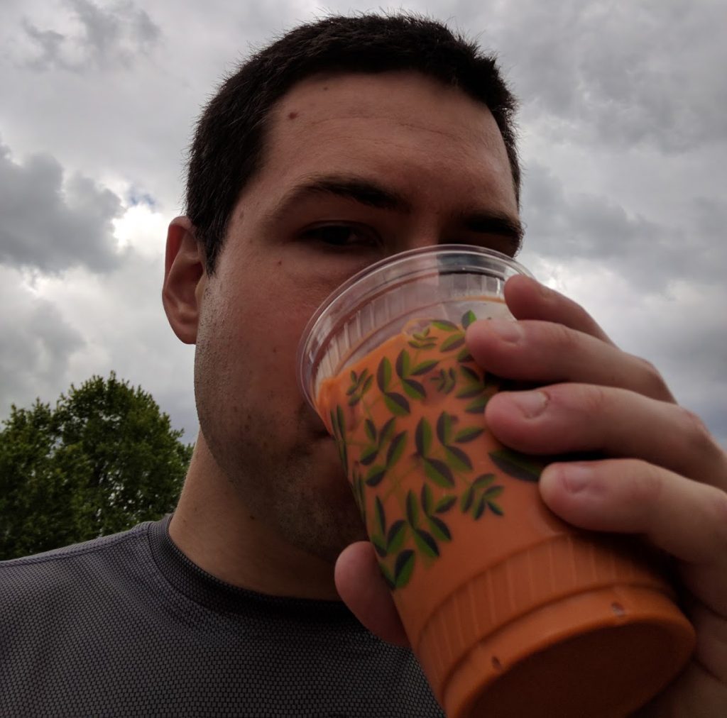 Enjoying a Thai ice tea as Sam completes the trail.